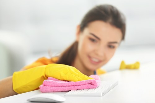 Cleaner preparing a kitchen for new occupants in Queenspark
