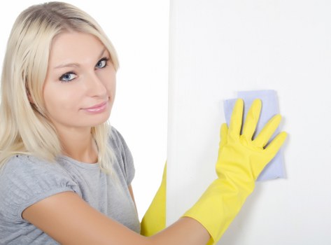 Local technician cleaning a greasy oven interior in Queenspark