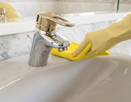 Deep cleaning a lounge sofa with attention to stains and fabric care in Queenspark